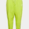 Nike Sportswear AIR PANT PLUS - Tracksuit Bottoms - Atomic Green/limelight